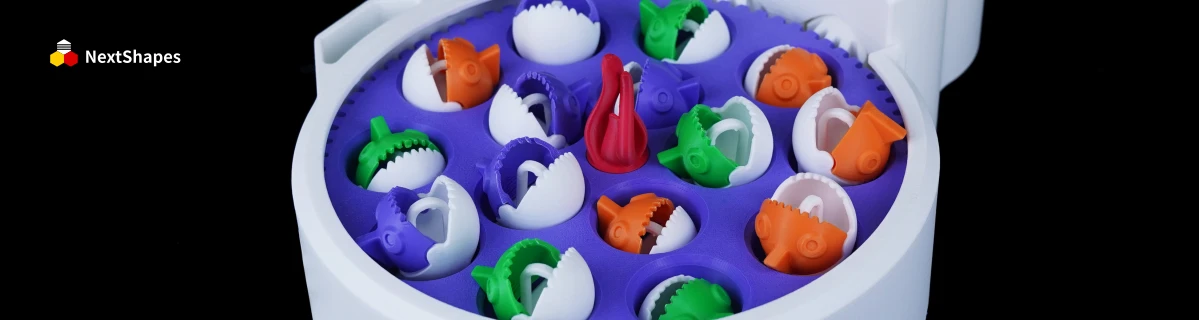 Collection of 3D printed colorful toy components (fish, shell shapes) made with NextShapes Standard PLA filament, showcasing delicate texture, vibrant colors, and high impact resistance