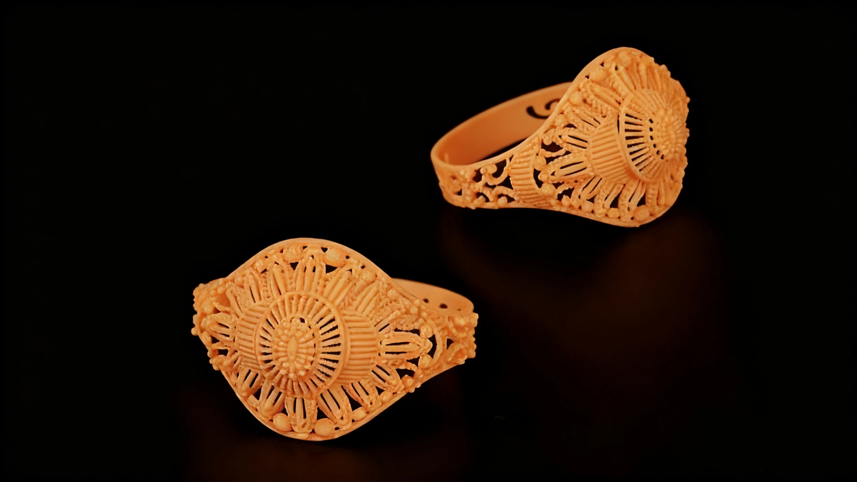 Display of 3D printed lace ring prototypes made with NextShapes HR 12K Pro Resin, demonstrating filigree precision and sharp edge definition