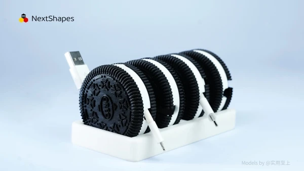 Multi-set view of 3D printed Oreo-shaped data cable storage boxes made with NextShapes Standard PLA filament, demonstrating functional cable management, precise dimensional accuracy, and durable smooth-opening design