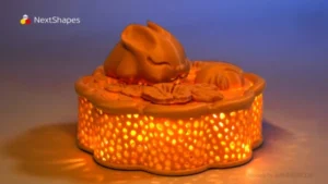 Lit effect display of 3D printed Mid-Autumn mooncake rabbit lamp made with NextShapes Standard PLA filament, showcasing hollow pattern crack resistance, fine texture detail, and warm festive glow