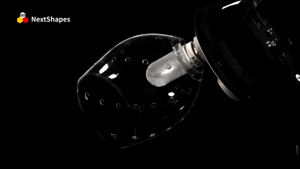 Close-up of a 3D printed transparent lamp shade component made with NextShapes 8001 transparent resin, showcasing 90.6% light transmittance, bubble-free clarity, and precise dimensional stability