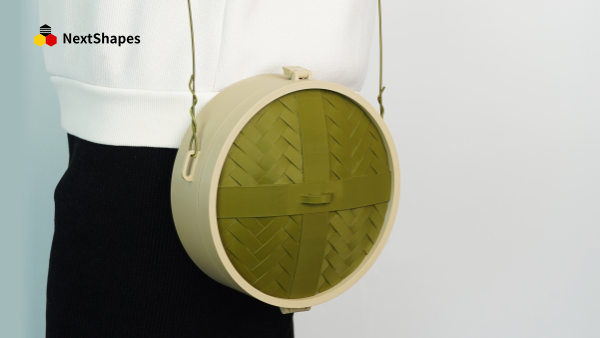 Close-up of a 3D printed steamer-shaped crossbody bag made with NextShapes Standard PLA filament, showing smooth surface finish and precise woven texture details.