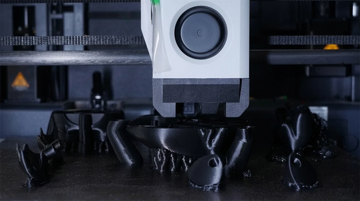 Batch printing display of 3D printed drone components made with NextShapes PLA CF filament, highlighting scalable in-house production capability
