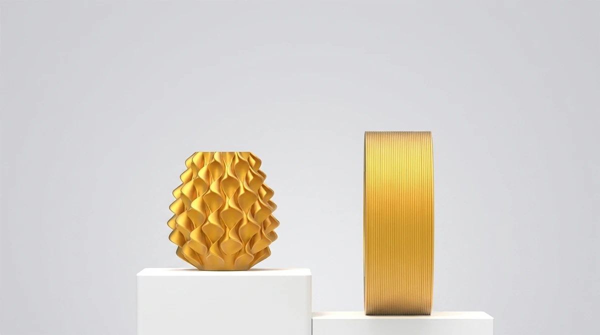 NextShapes-PLA-Silk-Filament-3D-printed-gold-decorative-vase-and-filament-spool-display