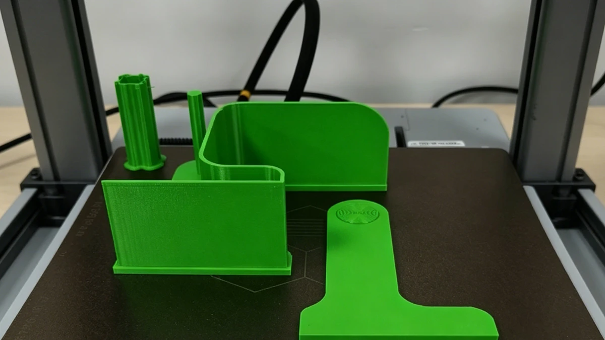 In-progress printing view of 3D printed green functional parts made with NextShapes PETG HF filament, demonstrating high-speed printing stability and layer adhesion
