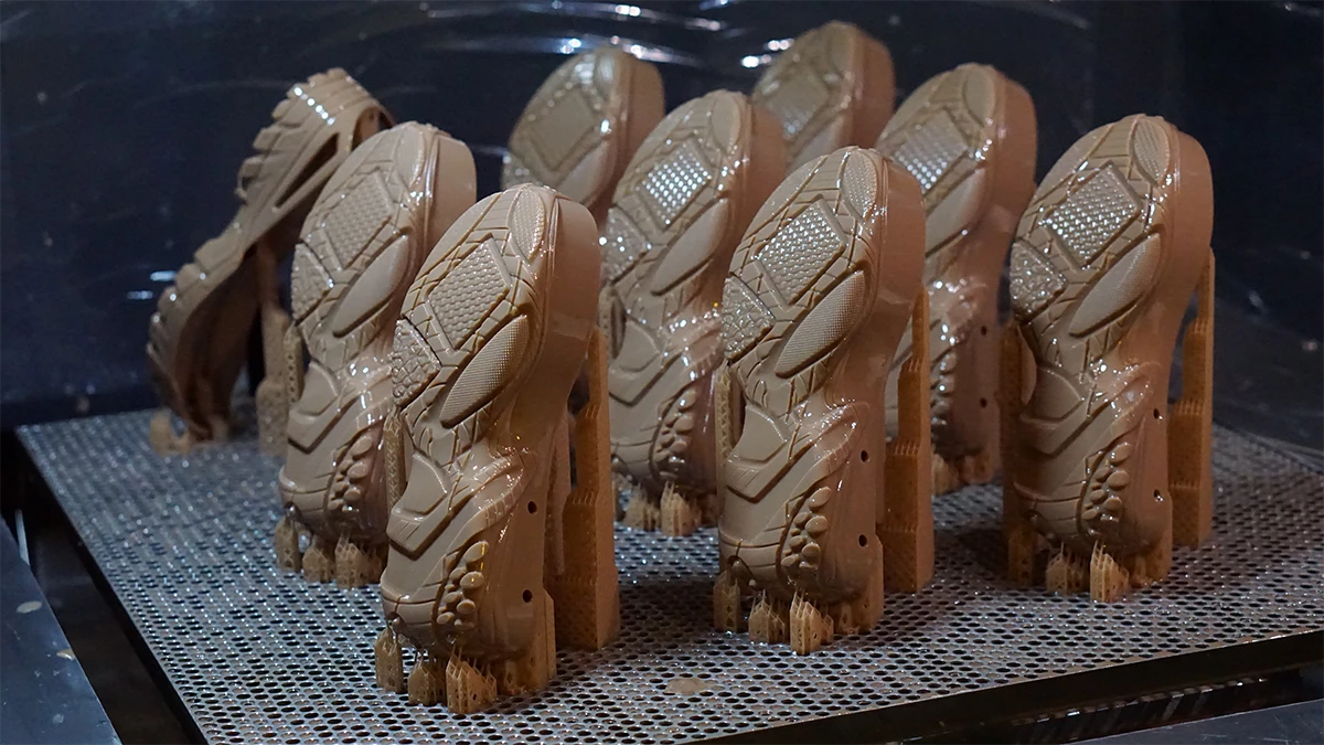 Batch production display of 3D printed shoe sole models made with NextShapes Precision Model Resin, highlighting scalable SLA 3D printing capability and consistent quality