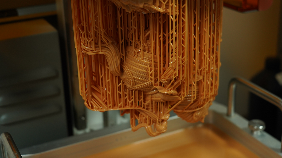3D printed model with support structures, demonstrating fine detail and dimensional stability of 8K Pro resin