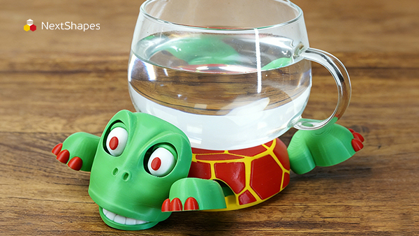 3D printed turtle character figure made with NextShapes Standard PLA filament placed on a desk, showing the smooth finish and dimensional stability of the material