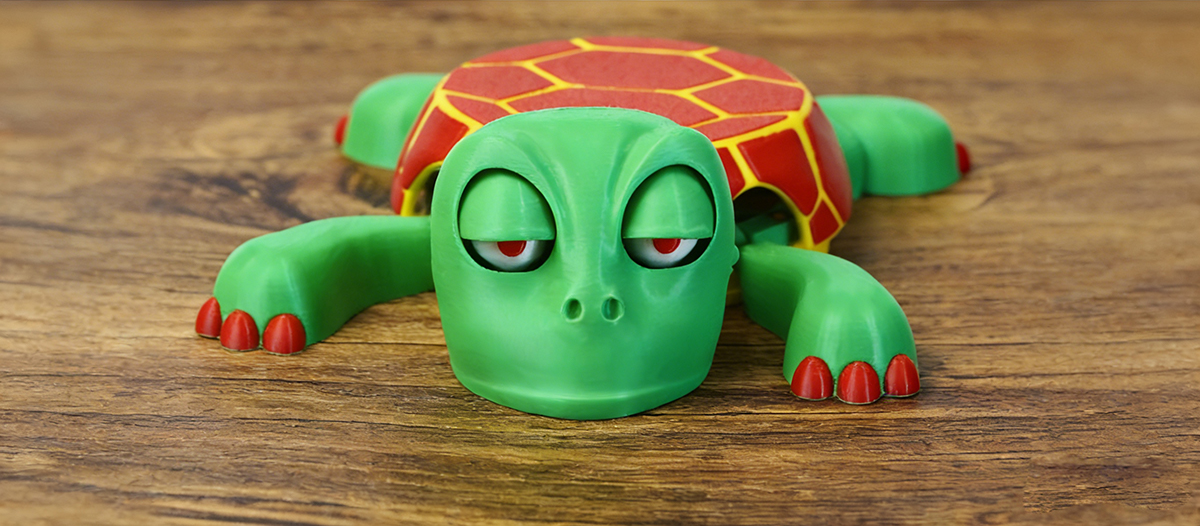 3D printed green turtle character figure made with NextShapes Standard PLA filament, showcasing the material's ability to reproduce smooth curves and fine details for cute IP designs