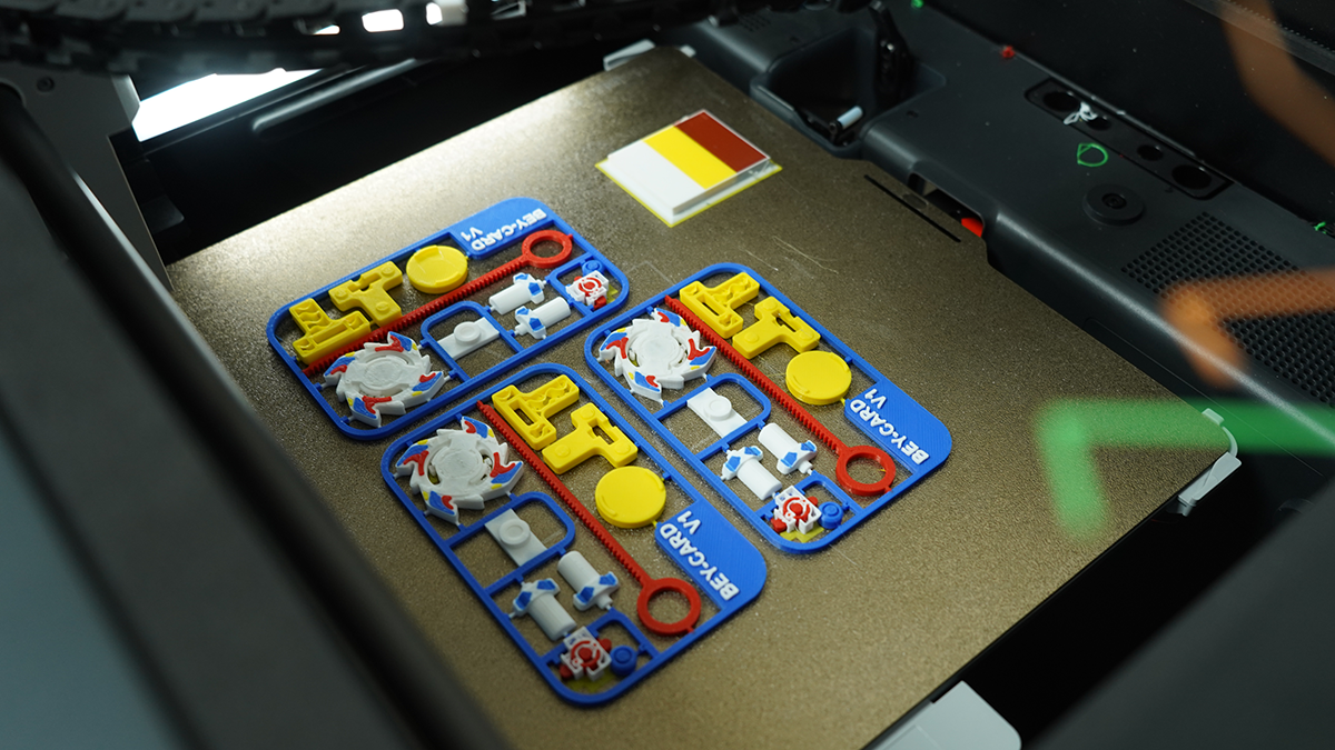Multiple 3D printed model kits on an FDM printer bed, showcasing the versatility of Standard PLA filament for hobbyist creations beyond figurines.